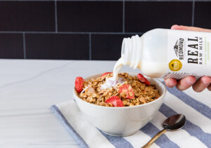 Milk being served in cereal